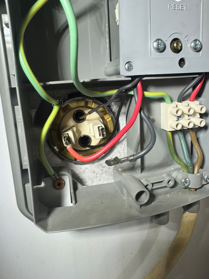 New immersion element and thermostats wired in at the head of an unvented hot water cylinder